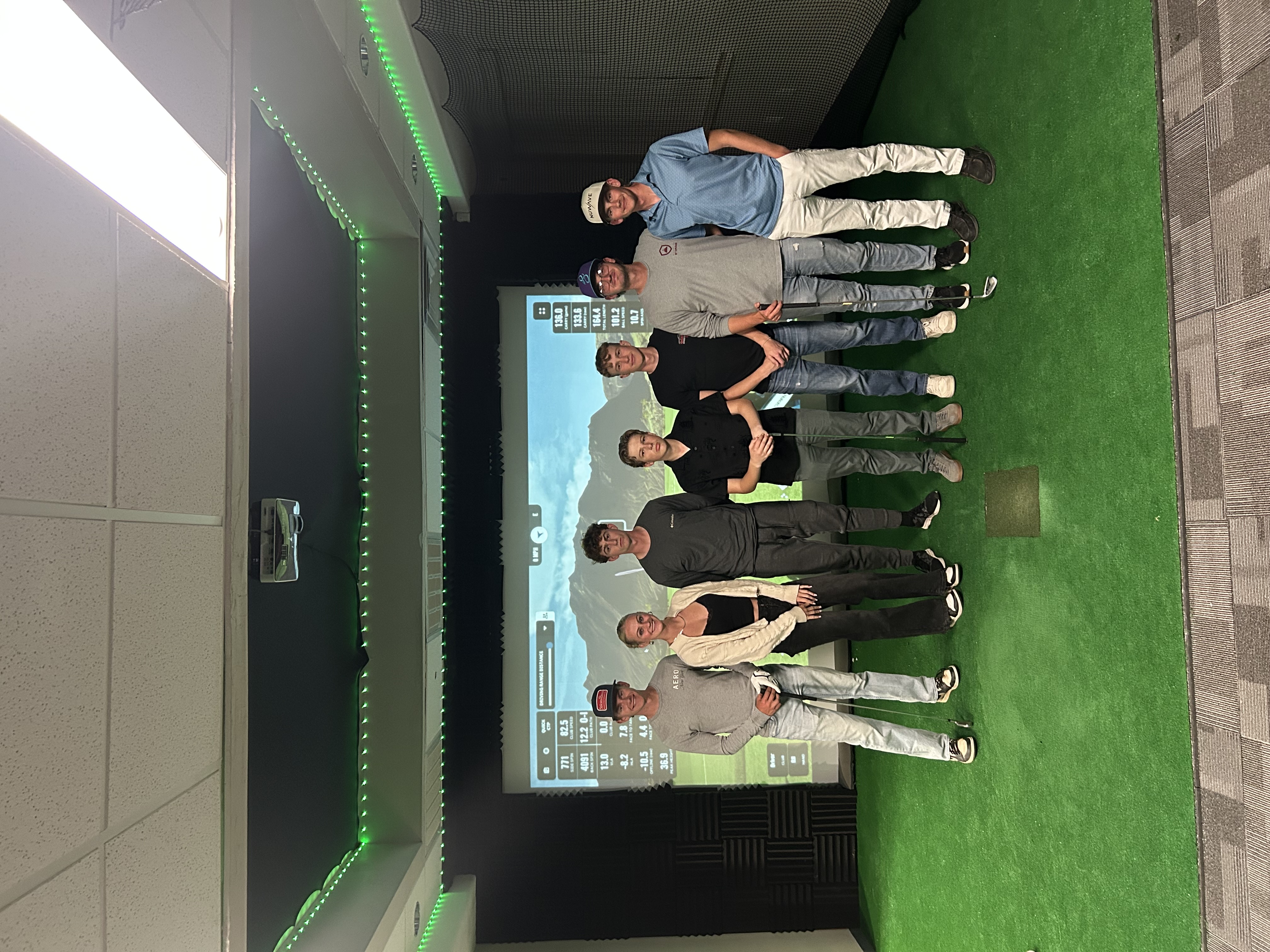 Group of golfers at the simulator